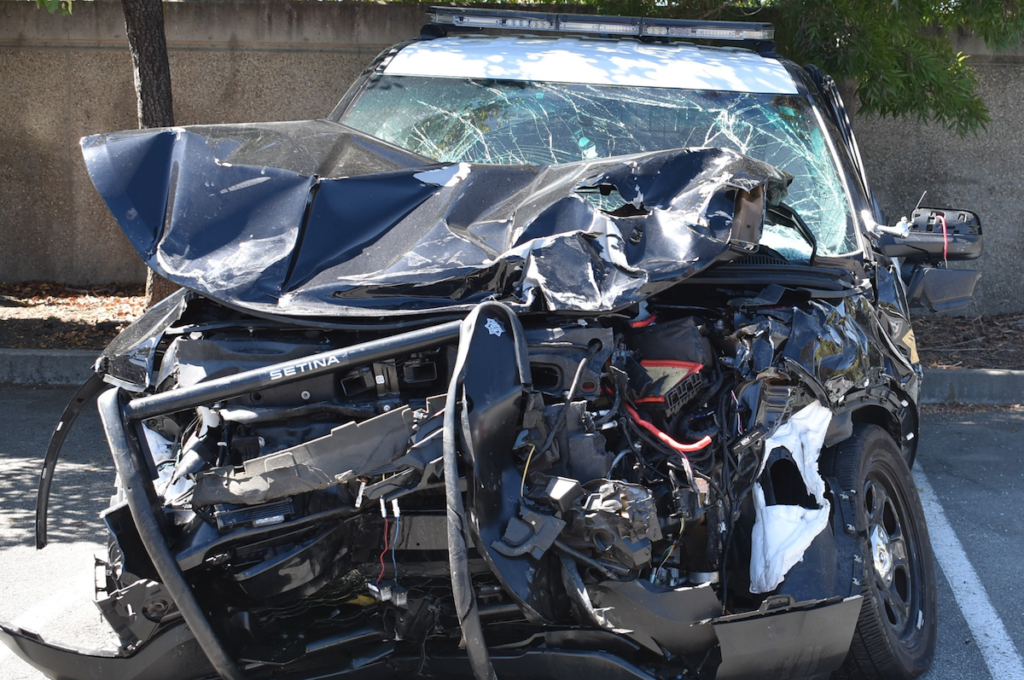 Hollister Police Department vehicle was wrecked when it hit an ongoing vehicle during a high speed chase.