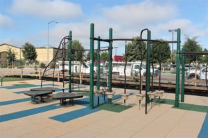 The shredded tires in the original playground have been replaced by padded tiles. Photo by John Chadwell.