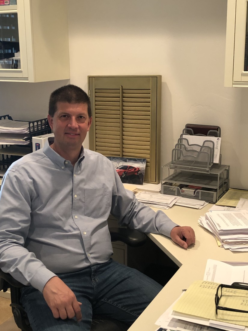 Bill Lee with documents pertaining to the embezzlement case. Photo courtesy of Bill Lee.