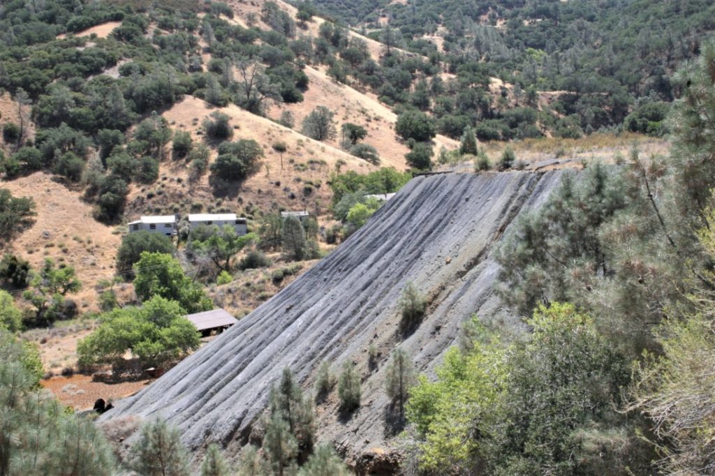 A pile of ore tailings left behind after the mine closed in 1972. Photo by John Chadwell.