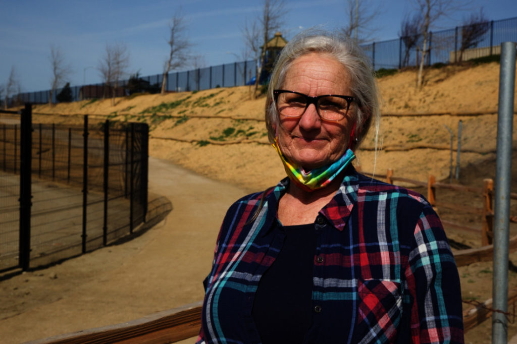 Robin Pollard, secretary treasurer of R.E.A.C.H. San Benito Parks Foundation, walks along the newest section of the River Parkway Trail. Photo by Leslie David.