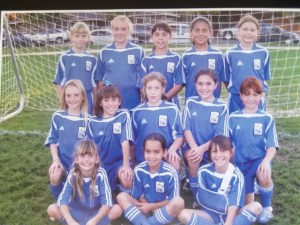 Suzy Brookshire (middle row, right) in the Hollister Roadrunners team photo. 2006 class 1 Abrozino League Champions. Photo courtesy of Ted Vandenberg.