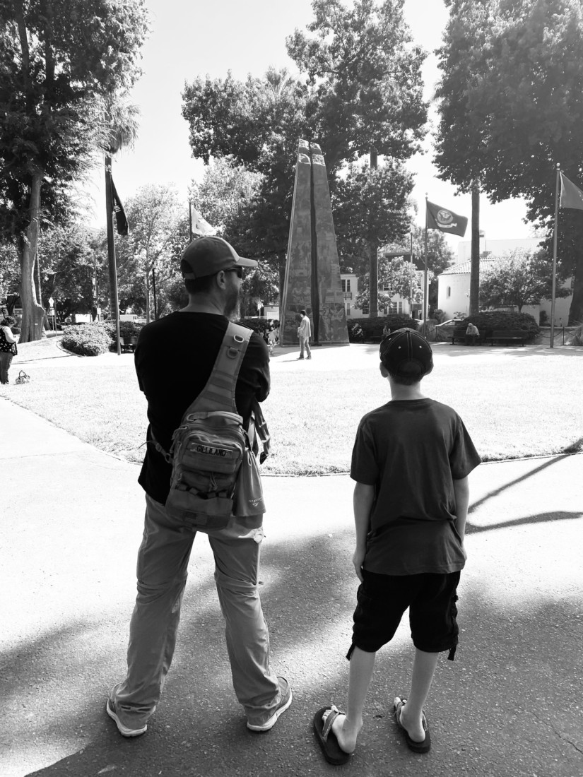 Chase and his father looking at the Veterans Memorial. Photo courtesy of Jessica Gililland.