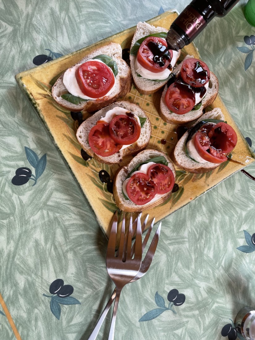 Balsamic Vinegar over tomatoes and mozzarella. Photo by Robert Eliason.